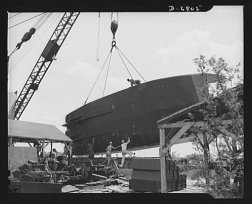 Production. Fifty-foot steel ramp boats. A new fifty-foot steel ramp boat, which has just passed its trial runs at a Southern boatyard, is removed from the water to be prepared for railroad shipment. Boats of this kind are used in making beach landings of men, tanks and other equipment on hostile sh