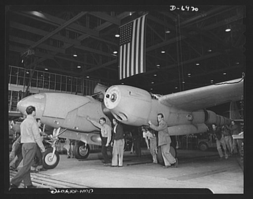 Production. Lockheed P-38 pursuit planes. Another twin-engined pursuit plane, a Lockheed P-38, is rolled from the floor of a large Western aircraft plant. On the field it will be fitted with two sets of three-bladed propellers that will pull it through brilliant performances as interceptors of enemy