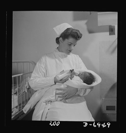 Nurse training. Just as they take biology and chemistry, students of nursing "take babies" as the young nurses say. Here Susan learns how to give a baby one of his first meals