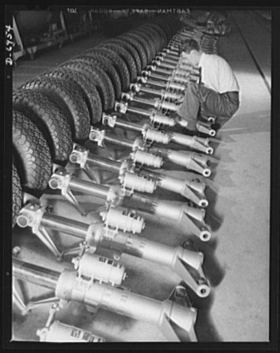 Production. B-25 bombers. Nose wheels for B-25 bombers lined up for inspection at a big Western aircraft plant. General Doolittle, who flew in a B-25, has called this bomber the best militiary plane in existence. Many men and women were quickly trained in this plant for the various operations necess