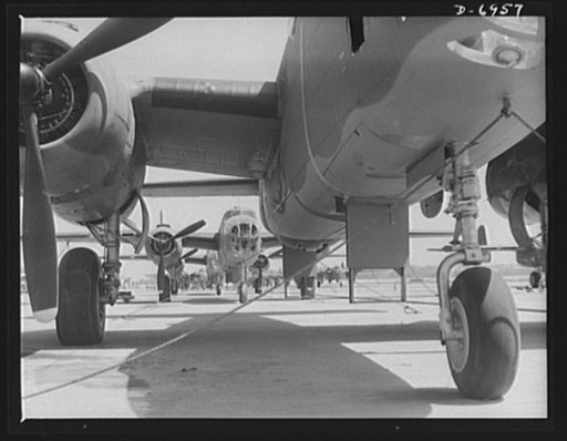 Production. B-25 bombers. New B-25 bombers lined up for final inspection and tests at the flying field of a Western Aircraft plant. General Doolittle, who flew in a B-25 in the raid on Tokyo, has called this ship the best military plane in existence. It performs brilliantly at its 25,000-foot ceilin