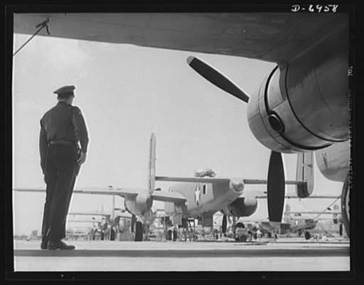 Production. B-25 bombers. New B-25 bombers lined up for final inspection and tests at the flying field of a Western Aircraft plant. General Doolittle, who flew in a B-25 in the raid on Tokyo, has called this ship the best military plane in existence. It performs brilliantly at its 25,000-foot ceilin