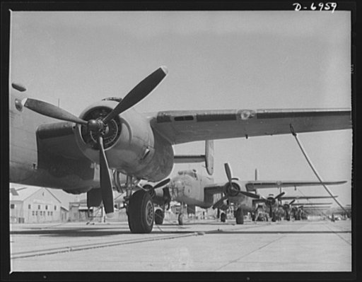 Production. B-25 bombers. New B-25 bombers lined up for final inspection and tests at the flying field of a Western Aircraft plant. General Doolittle, who flew in a B-25 in the raid on Tokyo, has called this ship the best military plane in existence. It performs brilliantly at its 25,000-foot ceilin