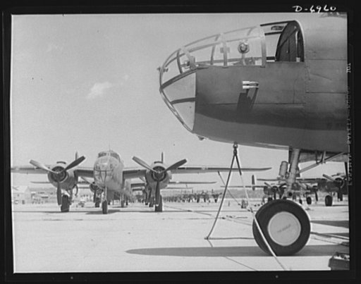 Production. B-25 bombers. New B-25 bombers lined up for final inspection and tests at the flying field of a Western Aircraft plant. General Doolittle, who flew in a B-25 in the raid on Tokyo, has called this ship the best military plane in existence. It performs brilliantly at its 25,000-foot ceilin
