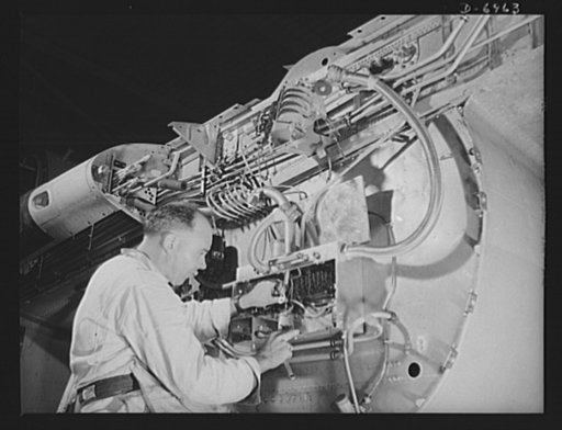 Production. B-25 bombers. Completing electrical wiring at a junction box in the center section of a B-25 bomber at a Western aircraft plant. General Doolittle has called the ship the best military plane in existence. With plenty of speed, a 1700-mile cruising range and a ceiling of 25,000 feet, it h