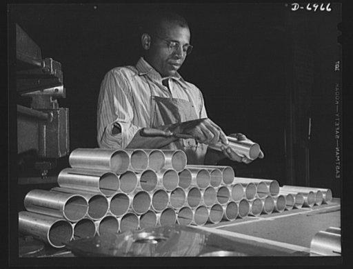 Production. B-25 bombers. Filing burrs from slots in sections of brass tubing used in construction of B-25 bombers at a Western aircraft plant. General Doolittle has called the ship the best military plane in existence. With plenty of speed, a 1700-mile cruising range and a ceiling of 25,000 feet, i