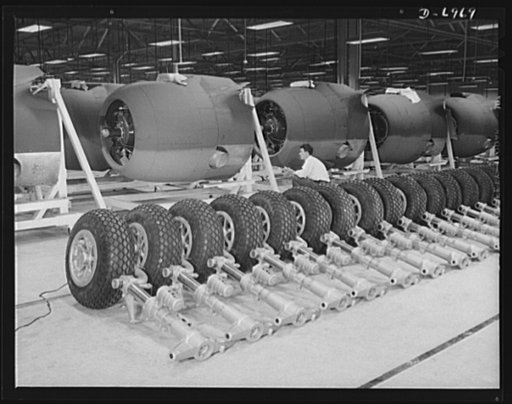 Production. B-25 bombers. Nose wheels and engines for B-25 bombers ready to go to the assembly lines of a Western aircraft plant. General Doolittle, who flew in a B-25 in the raid on Tokyo, has called the ship the best military plane in existence. With plenty of speed, a 1700-mile cruising range and
