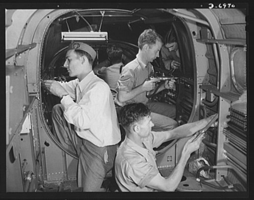 Production. B-25 bombers. Workmen at a Western aircraft plant perform finishing operation on a front section of a B-25 bomber. General Doolittle, who flew in a B-25 in the raid on Tokyo, has called the ship the best military plane in existence. With plenty of speed, a 1700-mile cruising range and a 