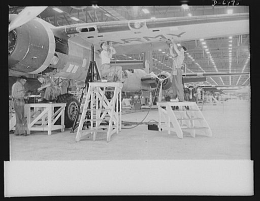 Production. B-25 bombers. Final assembly operations on the wing of a B-25 bomber in a Western aircraft plant. General Doolittle has called the ship the best military plane in existence. With plenty of speed, a 1700-mile cruising range and a ceiling of 25,000 feet, it has performed brilliantly as a m