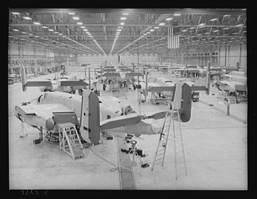 Production. B-25 bombers. Final assembly bay of a Western aircraft plant in which wings are installed on B-25 bombers. General Doolittle, who flew in a B-25 in the raid on Tokyo, has called the ship the best military plane in existence. With plenty of speed, a 1700-mile cruising range and a ceiling 
