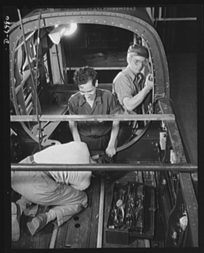 Production. B-25 bombers. A front section assembly for a B-25 bomber in a master jig at a Western aircraft plant. General Doolittle has called the ship the best military plane in existence. With plenty of speed, a 1700-mile cruising range and a ceiling of 25,000 feet, it has performed brilliantly as