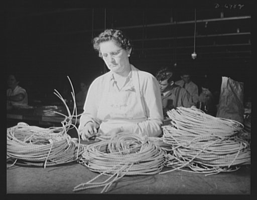 Production. B-25 bombers. Ignition wiring for B-25 (Billy Mitchell) bombers is prepared for use by a woman worker in a large Western aircraft plant. Many women are employed in this plant at jobs that once were considered exclusively men's work. Fairfax bomber plant, Kansas City