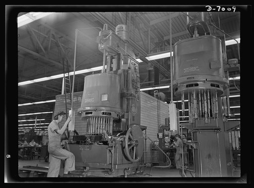 Women in war. Supercharger plant workers. A man-sized machine and a man-sized job are effectively handled by 21-year-old Virginia Grochowski of Milwaukee, Wisconsin. Employed by a Midwest supercharger plant, this former hosiery mill worker operates these giant drill presses as expertly as any man. A