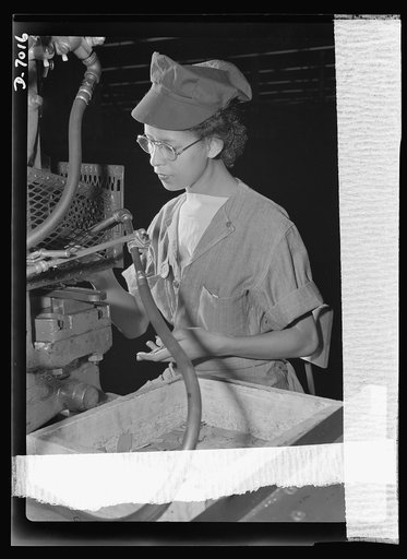 Women in war. Supercharger plant workers. Kay Lamphear, half American Indian and half Scotch-Norwegian, has joined the growing army of American women war workers. Employed by a large Midwest supercharger plant, this 21-year-old former costumes model operates a punch press, machining diaphragm blades