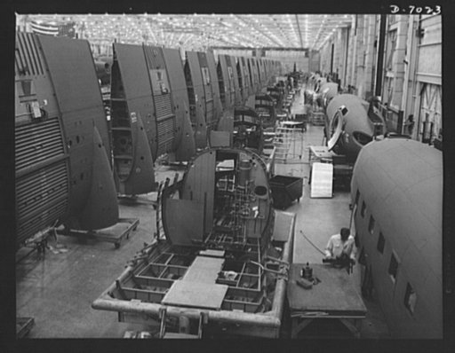 Production. C-47 transport plane. Sections of C-47 transport planes move down the assembly lines of the Long Beach, California plant of Douglas Aircraft Company toward the final assembly line, where all parts are put together. The versatile C-47 performs many important tasks for the Army. It ferries