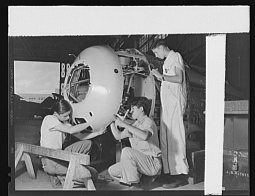Naval air base, Corpus Christi, Texas. Highly technical training is given by two National Youth Adminstration trainers, working with a civil service employee. This training will be valuable to the Army or Navy mechanized units should tag trainees be called to service. They work at the Corpus Christi