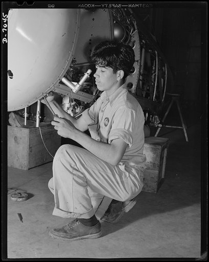 Naval air base, Corpus Christi, Texas. A Mexican neighbor, who crossed the border, now works under U.S. Civil Service in the assembly and repair department of the naval air base at Corpus Christi, Texas. Formerly he was a laborer in a warehouse