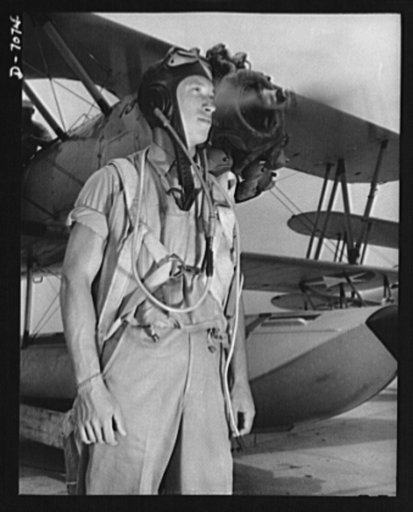 Naval air base, Corpus Christi, Texas. Summer flight uniforms for Naval cadets are light and give the flyer maximum freedom to operate. Cadet shown here is stationed at the naval air base in Corpus Christi, Texas.
