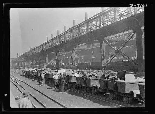 Salvage. Scrap for steel mills. Lineup of charging boxes awaiting the signal to start on the journey to the furnace floor of a Chicago steel mill. The scrap will be unloaded into electric furnaces, for processing into war weapons