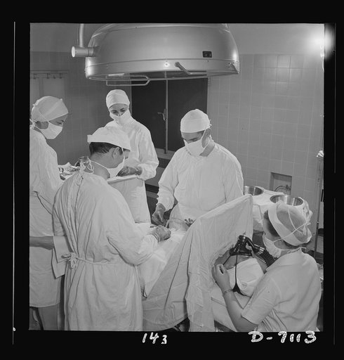 Nurse training. Young nurses assist at an appendectomy. This is part of the training with which every student nurse must be thoroughly conversant before she completes her training. With enough students to do this type of hospital work, graduate nurses can be released for duty with the armed forces