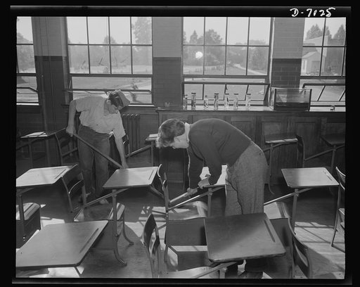 High school Victory Corps. James Parsley and Bill Sabin do their clean-up chores for the day in Montgomery Blair High School, Silver Spring, Maryland. Because of labor shortage, Victory Corps members at Montgomery Blair are taking over some of the janitor, mechanical and electrical repair activities