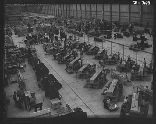 Production. B-24 bombers and C-87 transports. Sheet metal work benches at a large Western aircraft plant form an interesting pattern. Consolidated transport and bomber planes are built here. This new transport, an adaptation of the B-24 bomber, is known as the C-87, and carries one of the greatest h