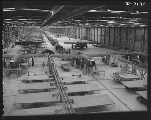 Production. B-24 bombers and C-87 transports. Final additions are made to the shell of a consolidated transport plane in preparation for its trip down the final assembly line of a Western aircraft plant. This new transport, an adaptation of the B-24 bomber, is known as the C-87, and carries one of t