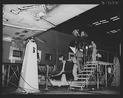 Production. B-24 bombers and C-87 transports. Final additions are made to the shell of a consolidated transport plane in preparation for its trip down the final assembly line of a Western aircraft plant. This new transport, an adaptation of the B-24 bomber, is known as the C-87, and carries one of t