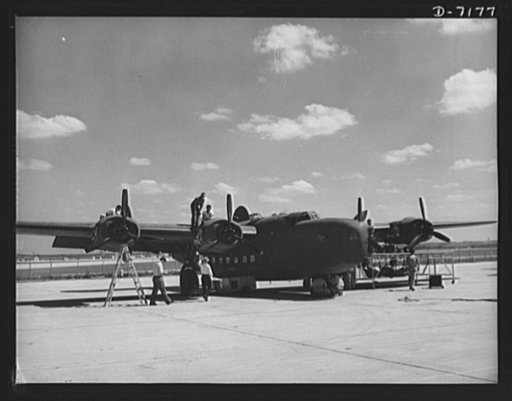 Production. B-24 bombers and C-87 transports. Another masterpiece of American mass production. A new consolidated transport, just off the assembly line of a Western aircraft plant, gets a final checkup preparatory to a test flight. This new transport, an adaptation of the B-24 bomber, is known as th
