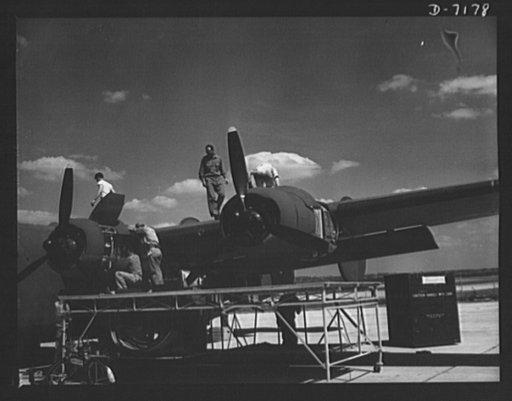 Production. B-24 bombers and C-87 transports. Another masterpiece of American mass production. A new consolidated transport, just off the assembly line of a Western aircraft plant, gets a final checkup preparatory to a test flight. This new transport, an adaptation of the B-24 bomber, is known as th