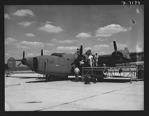 Production. B-24 bombers and C-87 transports. Another masterpiece of American mass production. A new consolidated transport, just off the assembly line of a Western aircraft plant, gets a final checkup preparatory to a test flight. This new transport, an adaptation of the B-24 bomber, is known as th