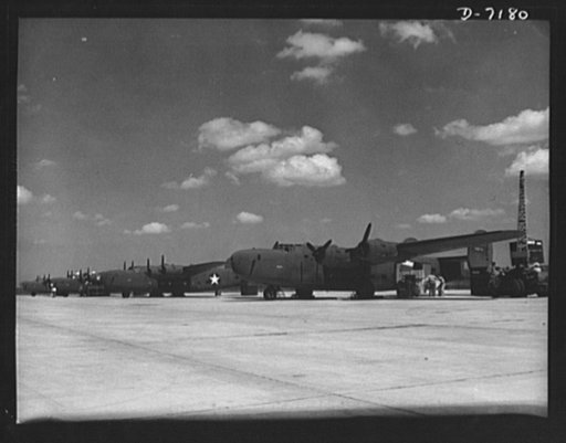 Production. B-24 bombers and C-87 transports. New consolidated transport, just off the assembly line of a Western aircraft plant are loaded with cargo. The site of the plant and flying field was a cow pasture not so long before Pearl Harbor. This new transport, an adaptation of the B-24 bomber, is k
