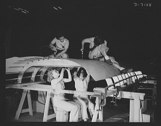 Production. B-24 bombers and C-87 transports. Girl riveting teams at a Western aircraft plant work on a belly cover for the cargo carrying adaptation of the B-24, which is known as the C-87. This new transport carries one of the greatest human or cargo loads of any plane now in mass production. It i