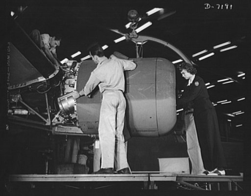 Production. B-24 bombers and C-87 transports. Lowering one of the four engines of a mighty consolidated transport plane at a Western aircraft plant. This new transport, an adaptation of the B-24, which is known as the C-87, and carries one of the greatest human or cargo loads of any plane now in mas