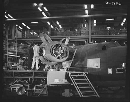 Production. B-24 bombers and C-87 transports. Installing one of the four engines of a mighty consolidated transport plane at a Western aircraft plant. This new transport, an adaptation of the B-24, which is known as the C-87, and carries one of the greatest human or cargo loads of any plane now in m