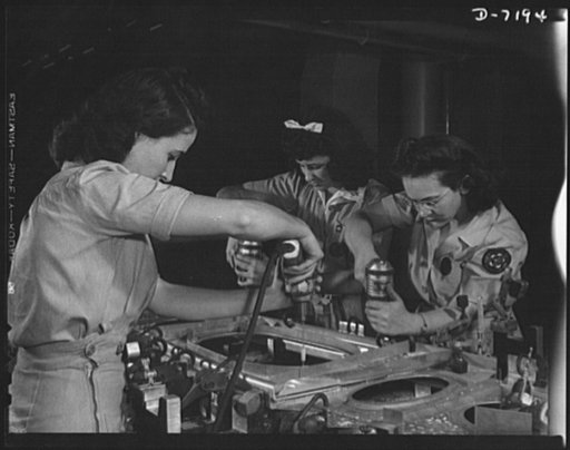 Production. B-24 bombers and C-87 transports. Drilling a wing bulkhead for a consolidated transport plane, that will carry American soldiers and equipment to our far-flung battle lines. One of these girls was a worker in a potato products factory, one was a laundering demonstrator and one is holding