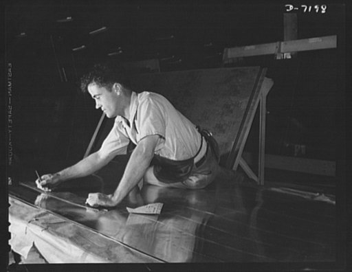 Production. B-24 bombers and C-87 transports. Tracing a template outline on a sheet of duralumin for the making of a part for a consolidated transport plane. This ship is adapted from the B-24 bomber. It carries one of the greatest human or cargo loads of any plane now in mass production.