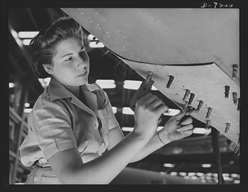 Production. B-24 bombers and C-87 transports. Ramy Presley sets Cleco fasteners with a pistol-like tool to hold a belly piece of a consolidated transport in place previous to riveting. This new transport, an adaptation of the B-24 bomber, is known as the C-87, and is now coming off the production li
