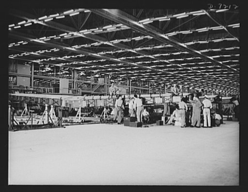 Production. B-24 bombers and C-87 transports. Center wing sections at a Western aircraft plant now producing consolidated B-24 bombers and transports. The new transport ship, an adaptation of the B-24 bomber, is known as the C-87, and carries one of the greatest human or cargo loads of any plane now