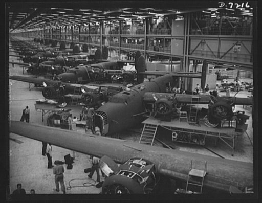 Production. B-24 bombers and C-87 transports. Giant consolidated transport ships nearing completion on the assembly line of a Western aircraft plant. These transports, adaptations of the B-24 bomber, carry one of the greatest human or cargo loads of any plane now in mass production