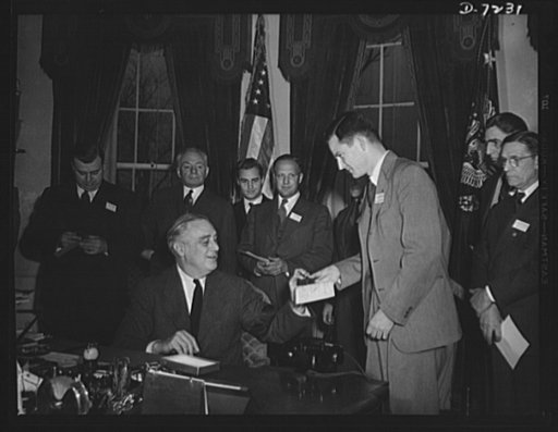 Citation winners. President Roosevelt, awarding a citation to James A. Merrill, an employee of the Goodyear Tire and Rubber Company, Akron, Ohio