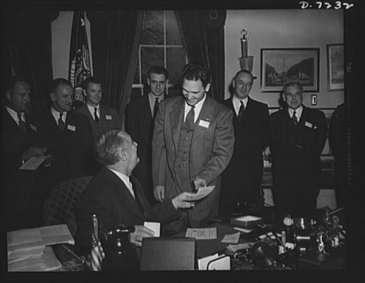Citation winners. President Roosevelt, awarding a certificate to George Smolarek, an employee of the Aircraft Engine Department, Packard Motor Car Company, Detroit, Michigan