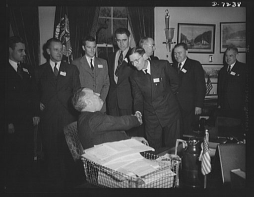 Citation winners. President Roosevelt, congratulating Joseph H. Kautsky an employee of the Dodge Plant, Link-Belt Company if Indianapolis, Indiana after presenting him a citation