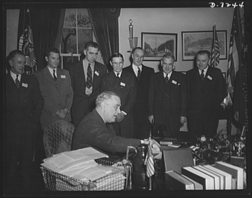 Citation winners. President Roosevelt is shown with the group left to right; Stanley Crawford, certificate winner, RCA Manufacturing Company, Camden, New Jersey; James Merrill, Goodyear Tire and Rubber Company, Akron, Ohio; Daniel W. Mallett, certificate winner, Mechanics Universal Joint Division, B