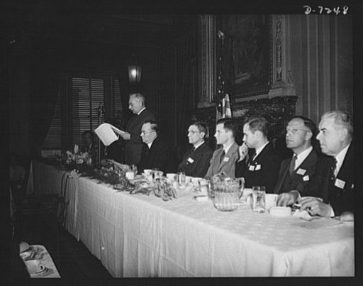 Citation winners. William G. Marshall, Director of the War Production Drive. Standing, is shown presenting the Honor Group at the luncheon tendered by Donald M. Nelson, Chairman of War Production Board (WPB), following the White House ceremony. Left to right: Mrs. Marshall, Mr. Nelson, Joseph H. Kau
