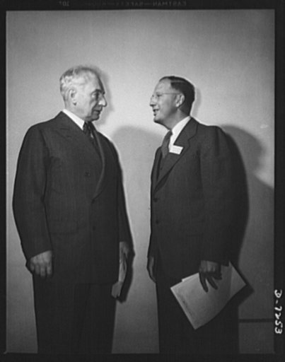 Citation winners. Citation winner, Clinton E. Hanna, (right) of the Westinghouse Electric and Manufacturing Company, East Pittsburgh, Pennsylvania, and William G. Marshall, Director of the War Production Drive, who presented the workers to President Roosevelt