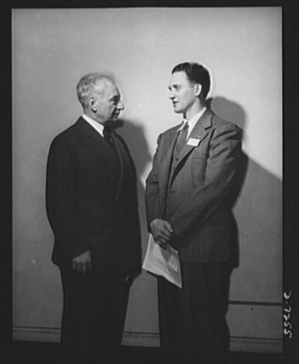 Citation winners. Certificate winner, George Smolarek (right), of the Aircraft Engine Department, Packard Motor Car Company, Detroit, Michigan, and William G. Marshall, Director of the War Production Drive, who presented the workers to President Roosevelt