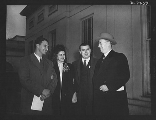 Citation winner. Donald M. Nelson, Chairman of the War Production Board (WPB), introduces two of the Detroit winners to "Miss Victory", also a Detroit war worker