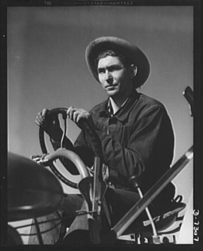 Manpower. Tractor driver. With the blood of the first Americans in his veins, this man, half Indian, has joined the production army and is helping to "give'em the stuff to fight with!" He is a tractor operator on a guayule rubber plantation in Salinas, California