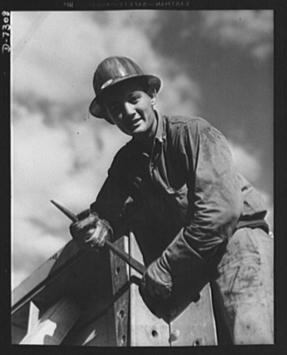 Tennessee Valley Authority. Construction of Douglas Dam. Rigger at the TVA's new Douglas Dam on the French Broad River. This dam will be 161 feet high and 1,682 feet long, with a 31,600 acre reservoir area extending forty-three miles upstream. With a useful storage capacity of approximately 1,330,00